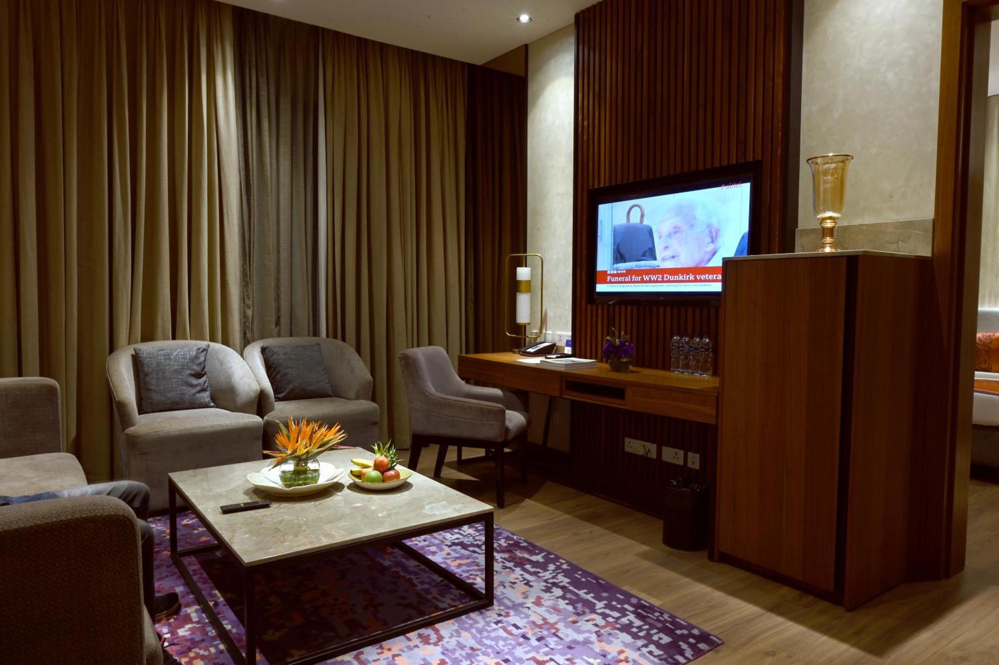 Vivanta Kolkata Em Bypass Exterior photo Living room of a suite at the hotel
