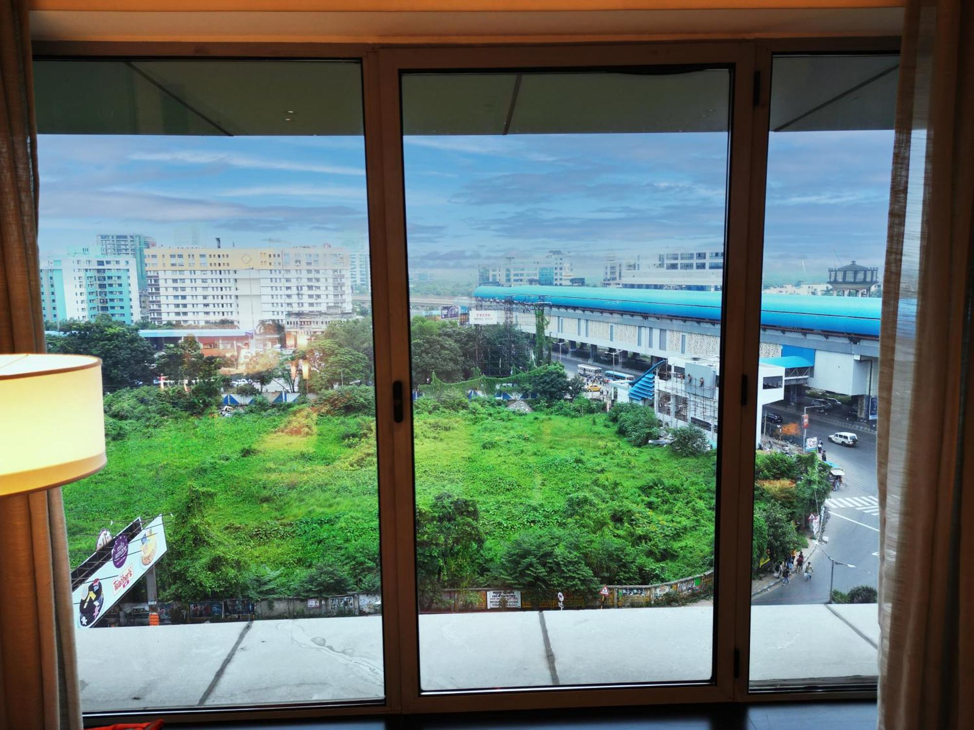 Vivanta Kolkata Em Bypass Exterior photo View of the station from a nearby hotel